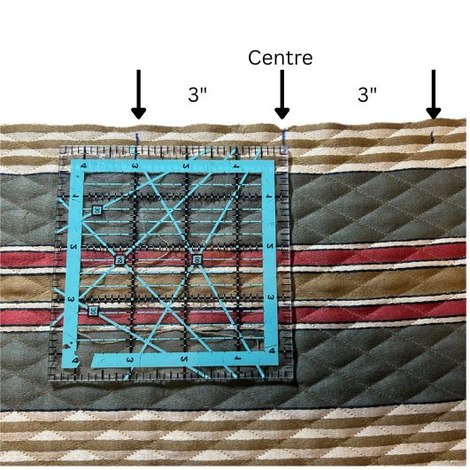 Close-up of tote bag showing measured strap placement and quilting lines