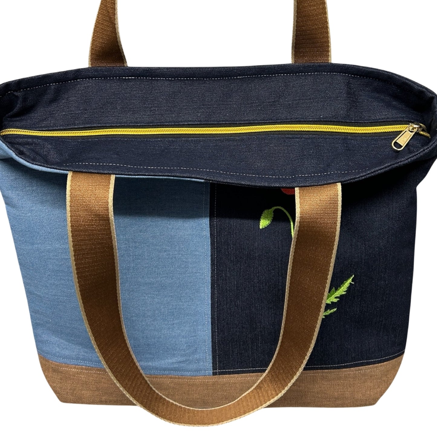 Multicolored tote bag with brown handles on a white background