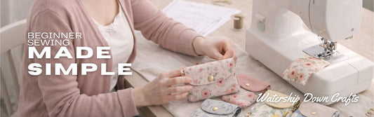 Woman sewing at a machine in a light workspace with handmade fabric wallets and pouches on the table, styled as a beginner sewing scene with text overlay “Beginner Sewing Made Simple”.