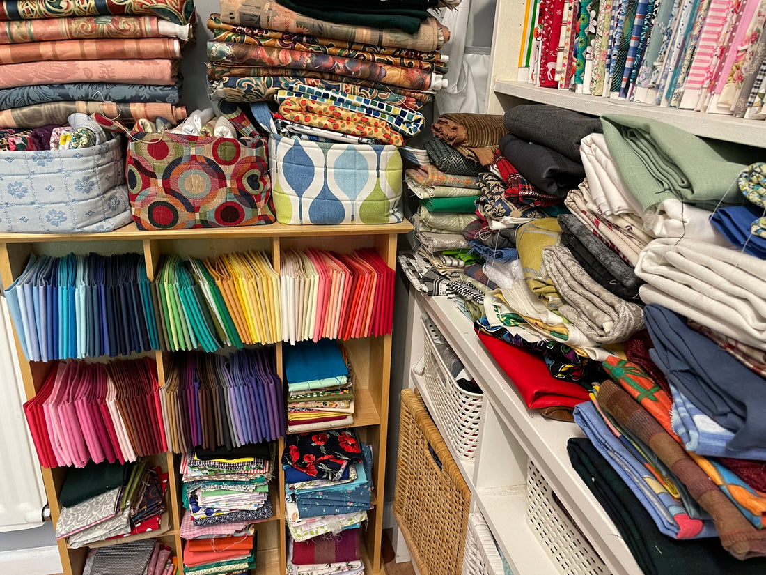 folded fabrics stored on shelves