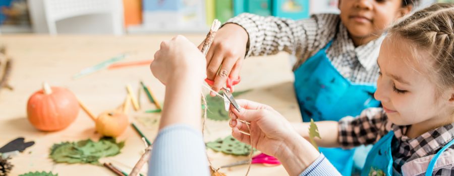 Children crafting with leaves