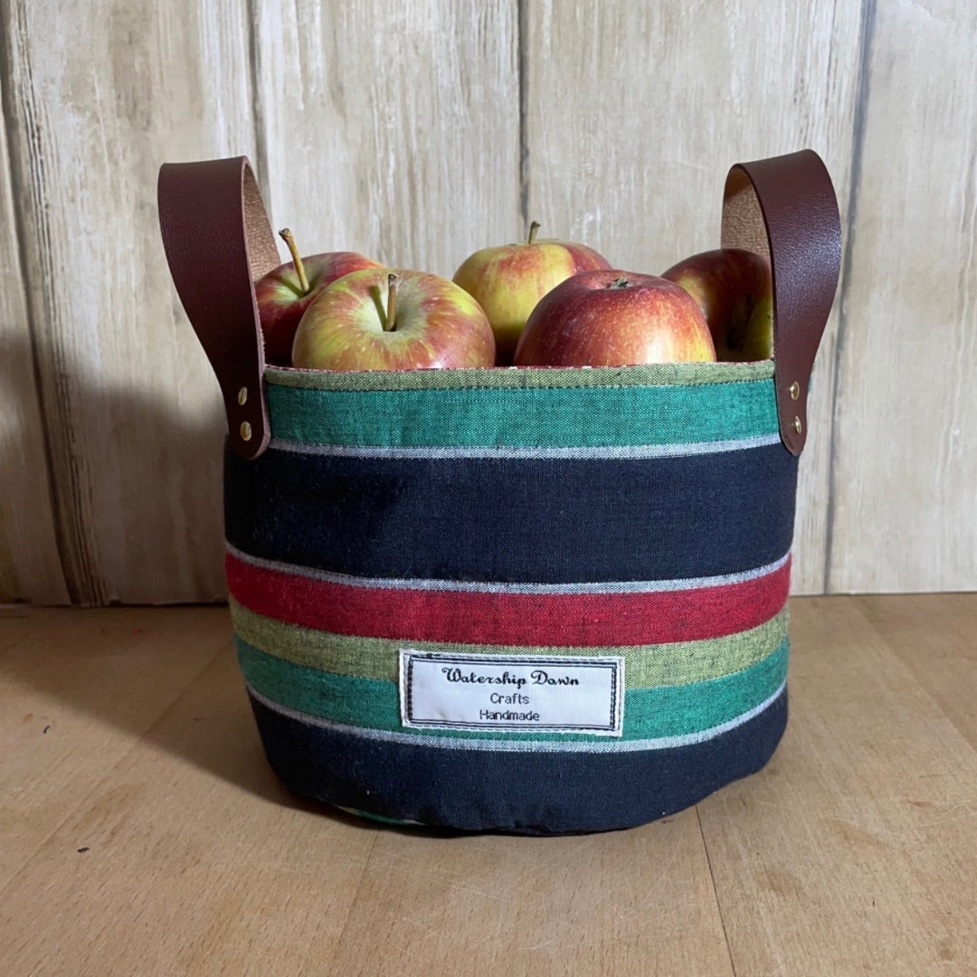 handmade stripe fabric basket with handles  containing apples 