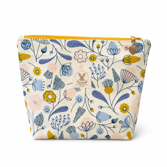 Floral-patterned pouch with a visible brand logo on a white background