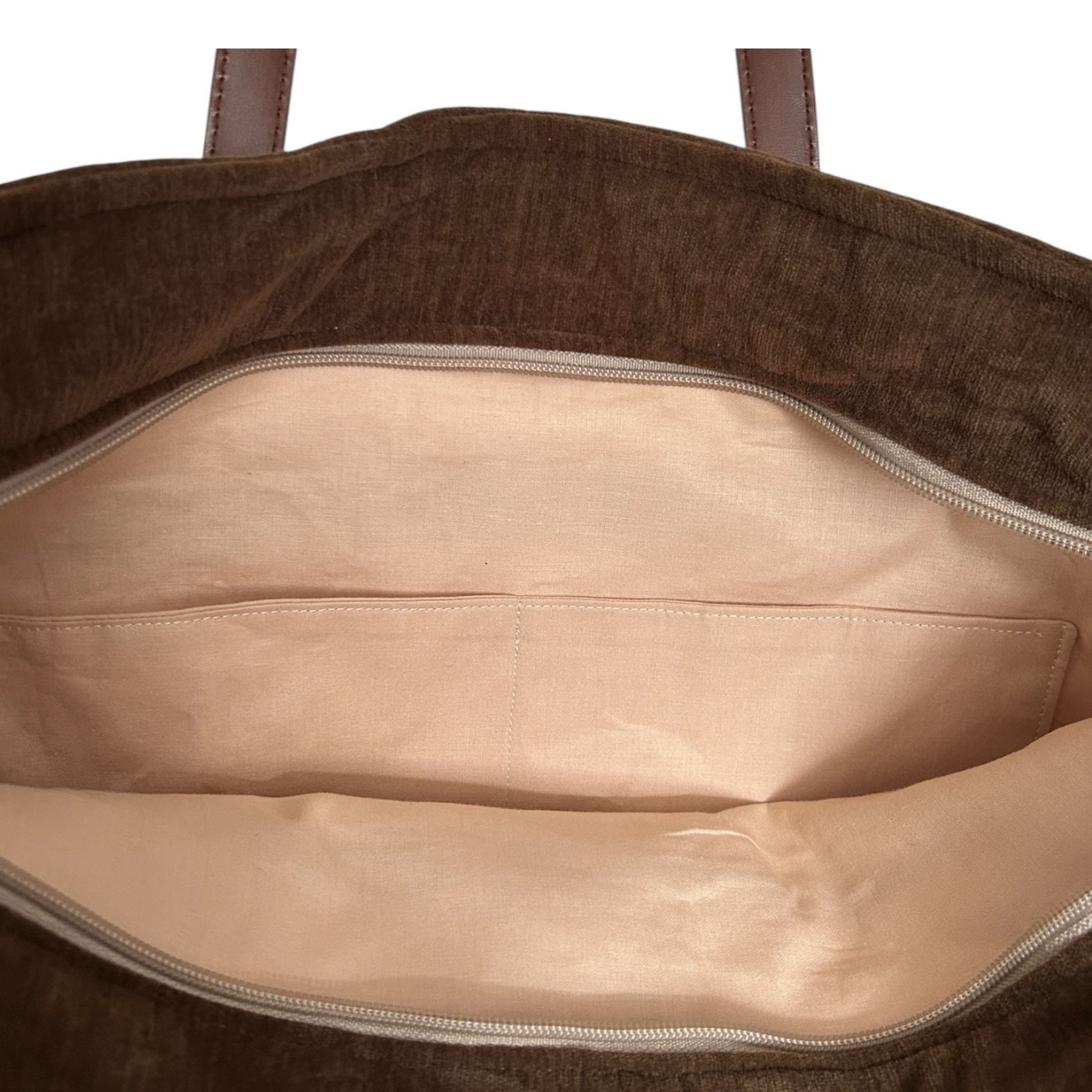 Brown garment bag with beige interior on a white background
