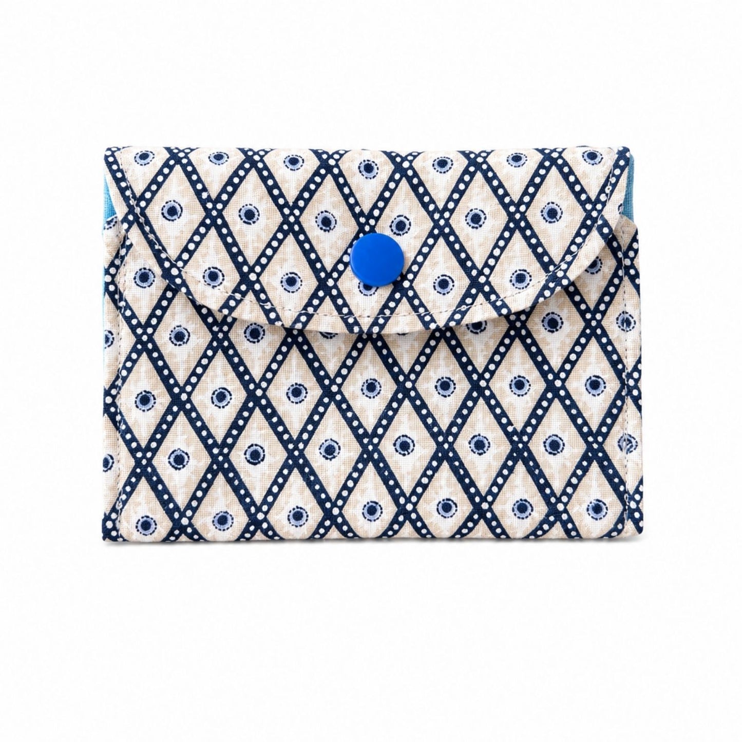 Patterned card wallet with a blue snap on a white background