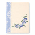 Notebook with floral design on a white background