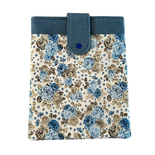 Blue floral tablet sleeve with snap closure and denim-style top trim, handmade from repurposed fabric.