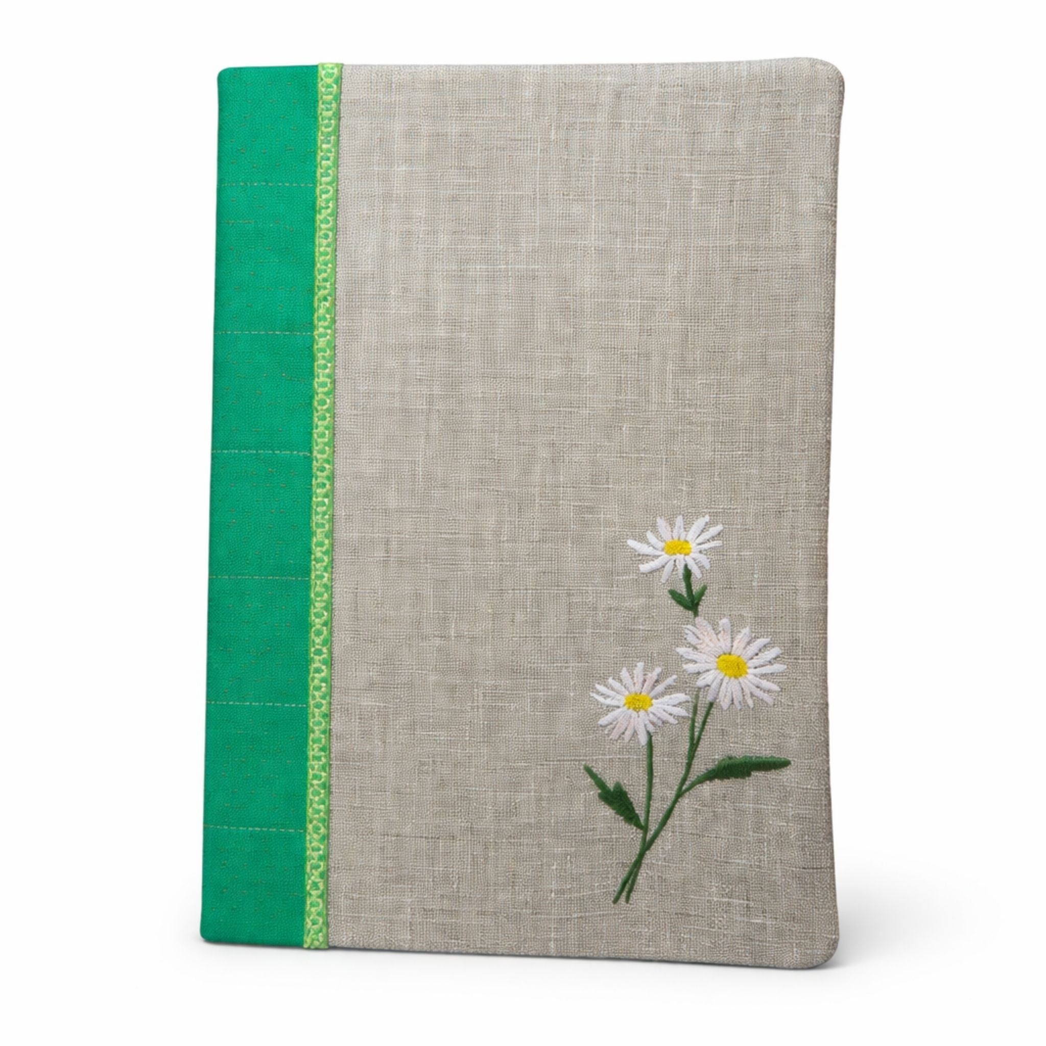 Notebook with floral design and green accent on a white background
