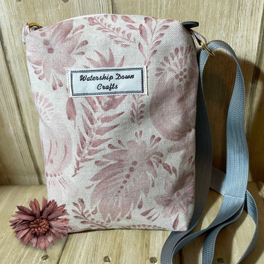 small crossbody bag made from  leaves and flowers  printed canvas