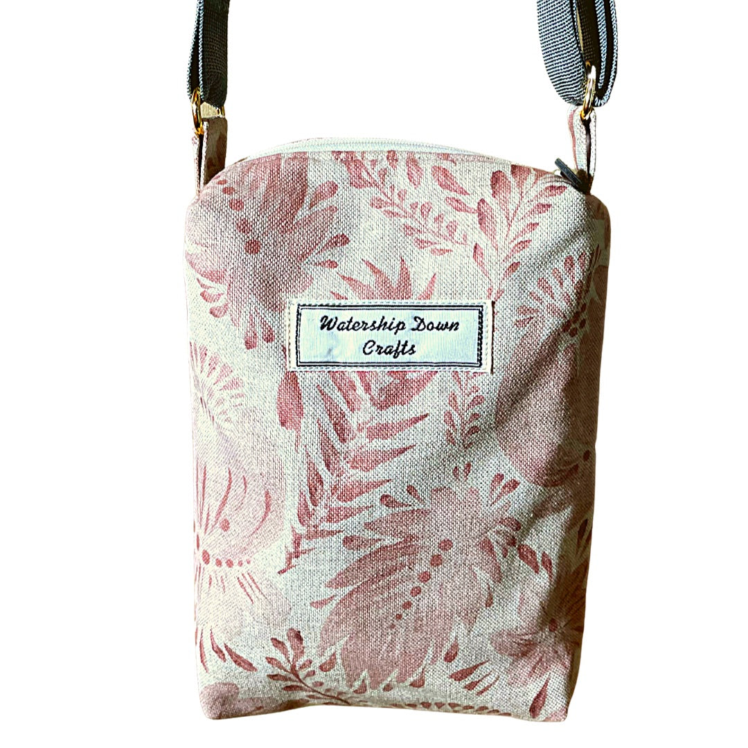 small crossbody bag made from leaves and flowers printed canvas hanging