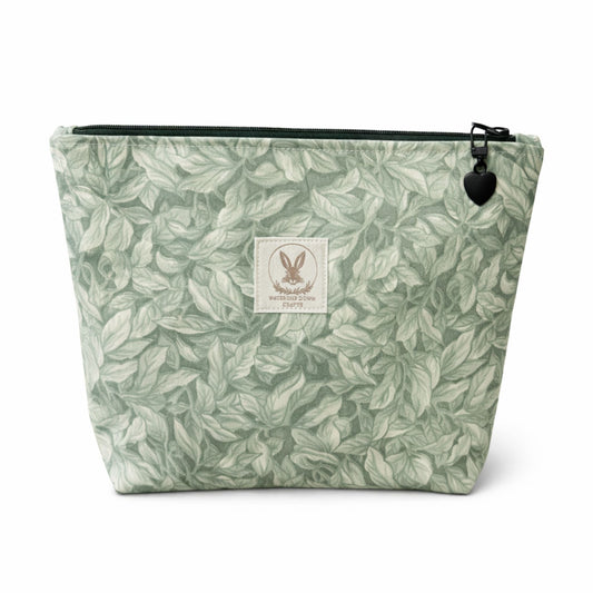 Green leaf-patterned pouch with a visible brand logo on a white background