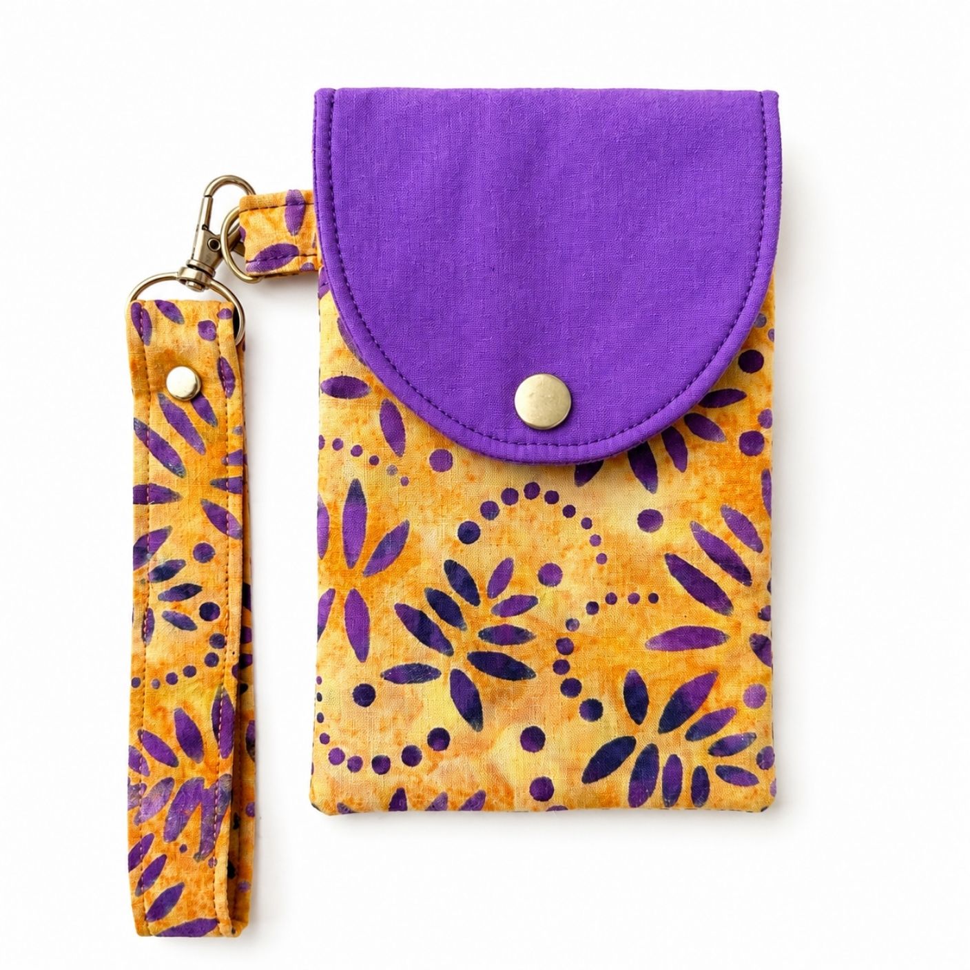 Purple and yellow patterned phone pouch with strap on a white background