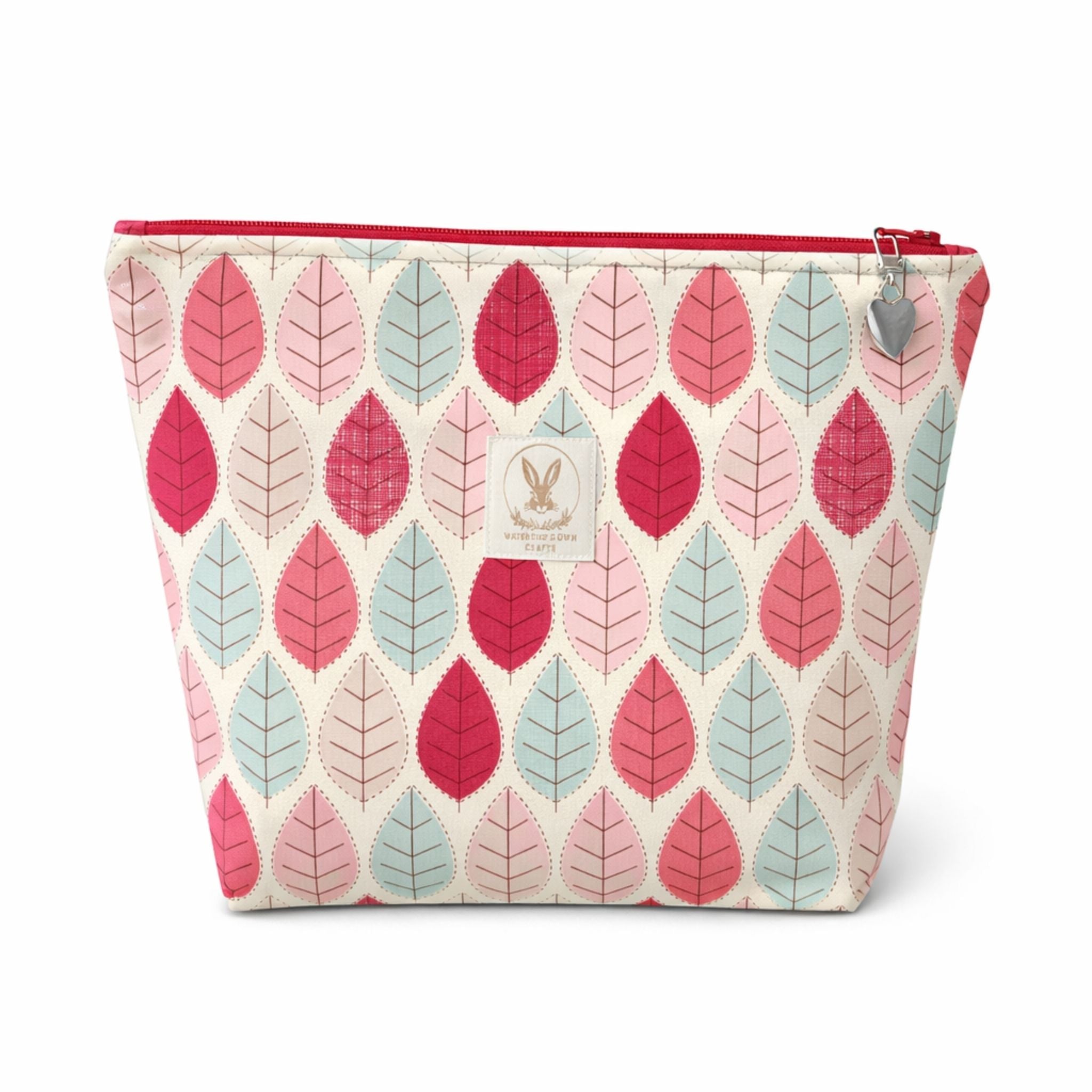 Cosmetic bag with leaf pattern on a white background