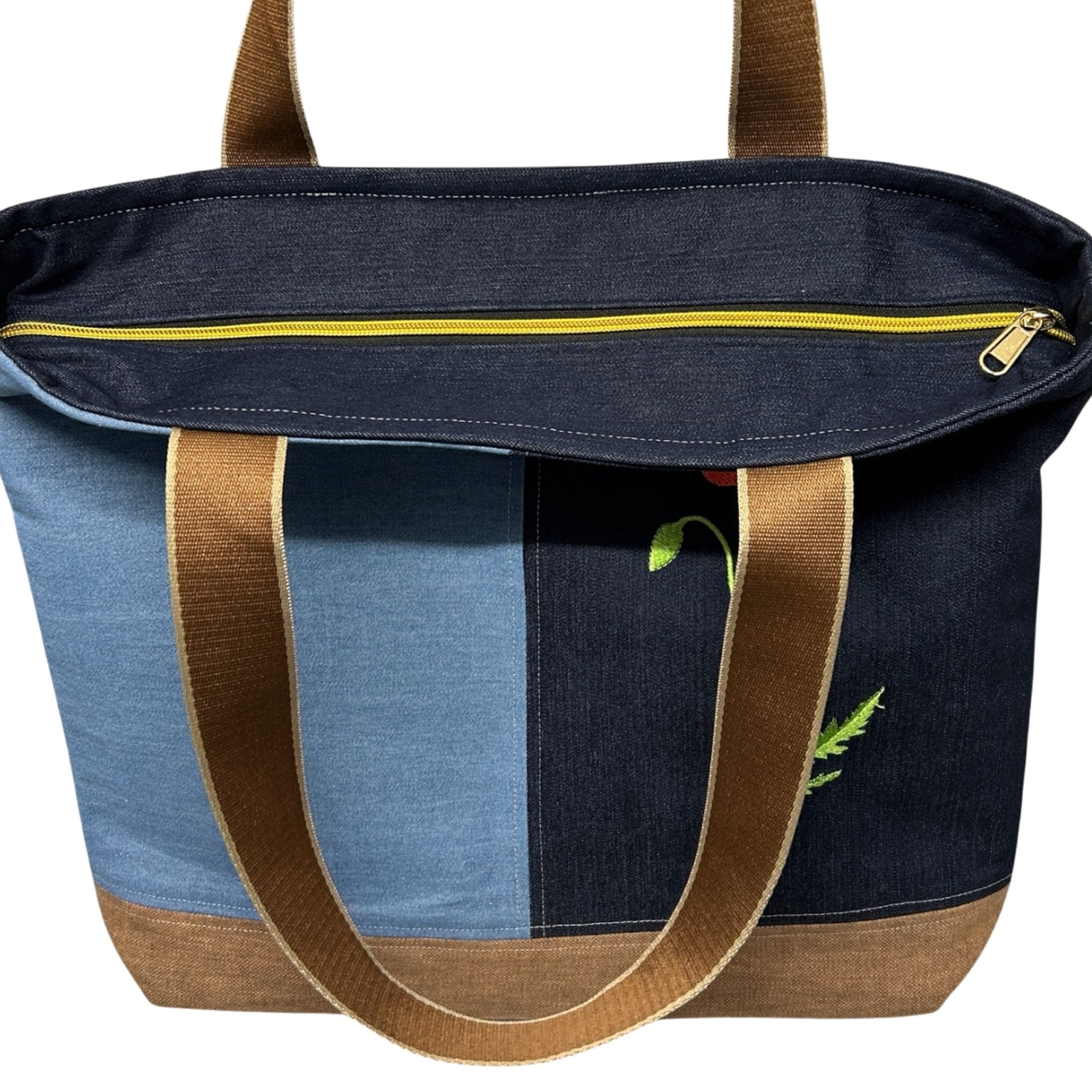 Multicolored tote bag with brown handles on a white background