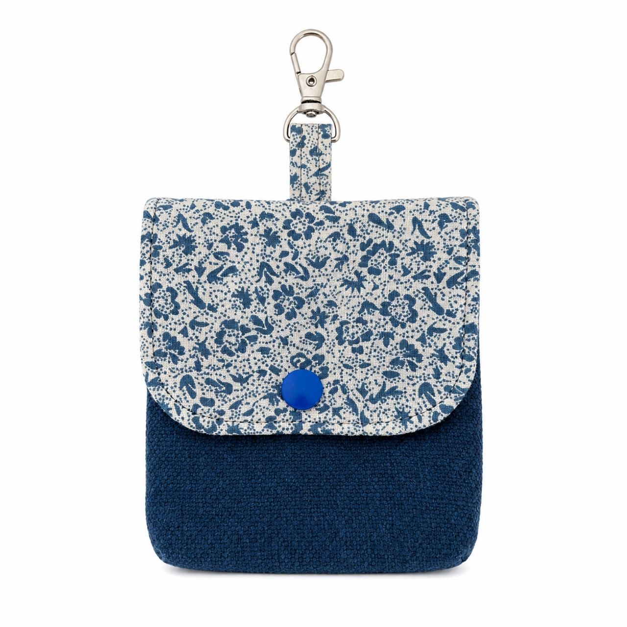 Small blue floral-patterned pouch with a blue button and key ring on a white background