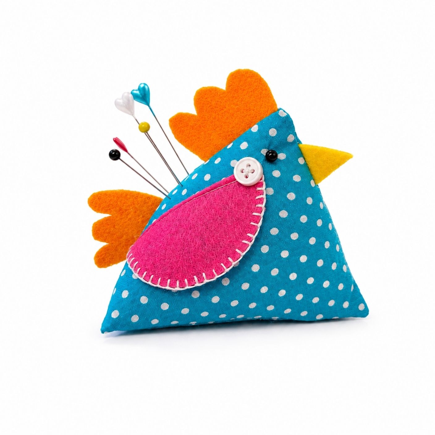 Colorful chicken-shaped pin cushion with pins on a white background