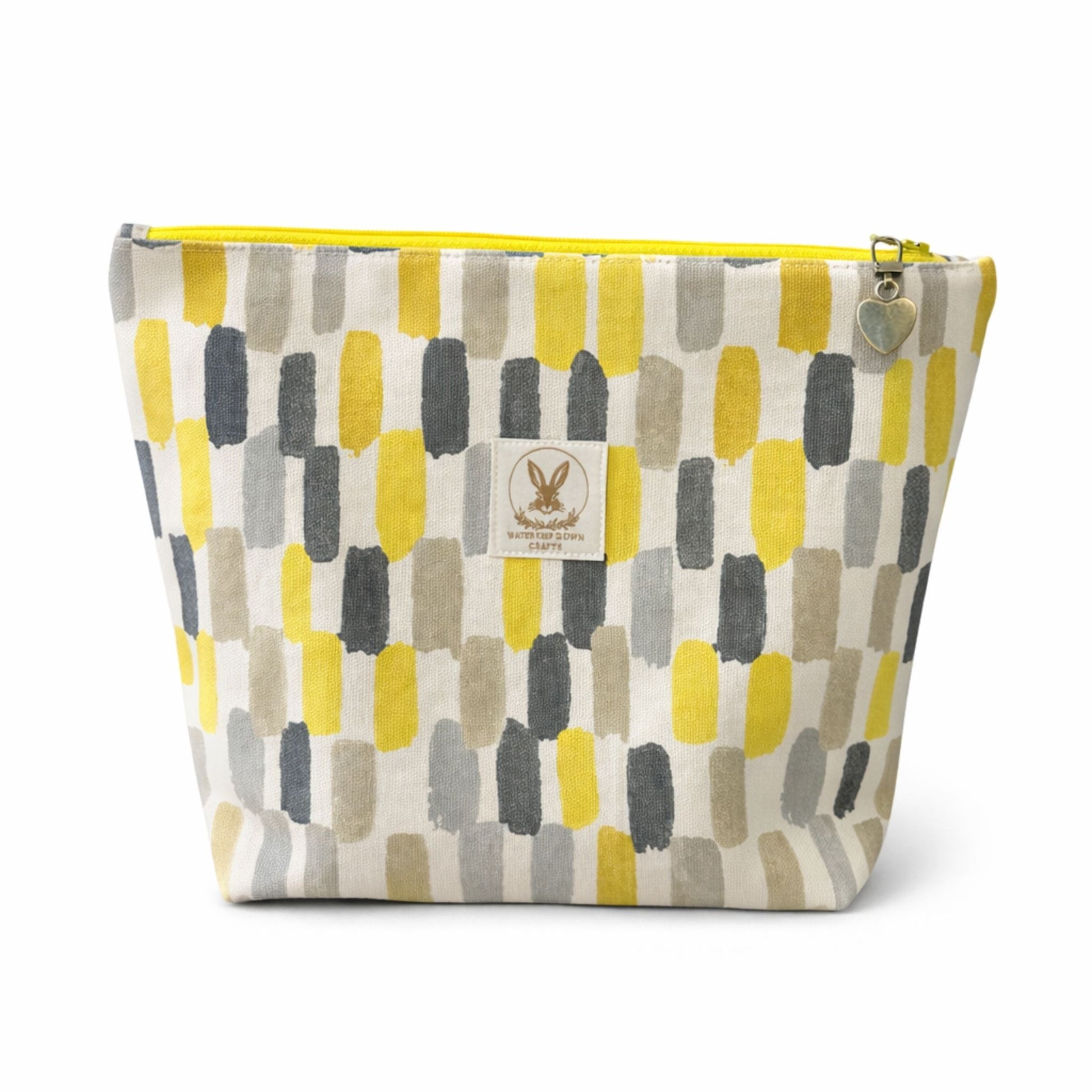 Fabric pouch with geometric pattern and visible brand logo on a white background