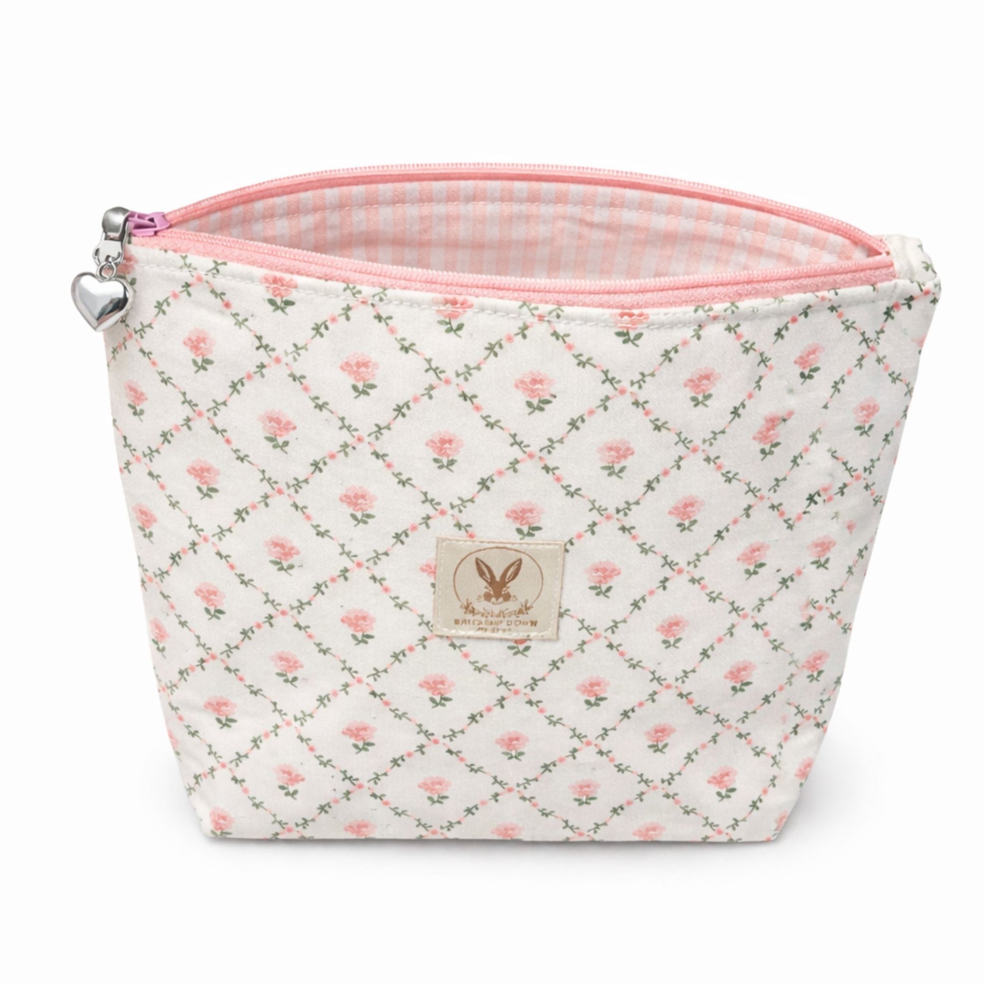 Small pouch with floral pattern and pink zipper on a white background