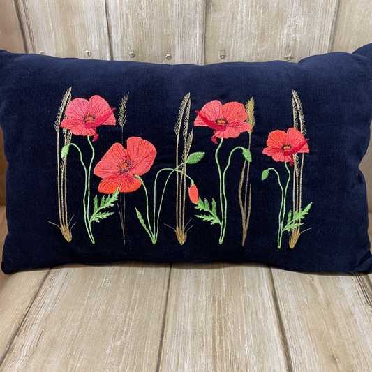 Cushion with embroidered poppies on navy blue