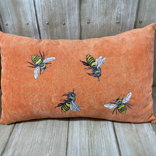 Rectangular cushion with embroidered bees