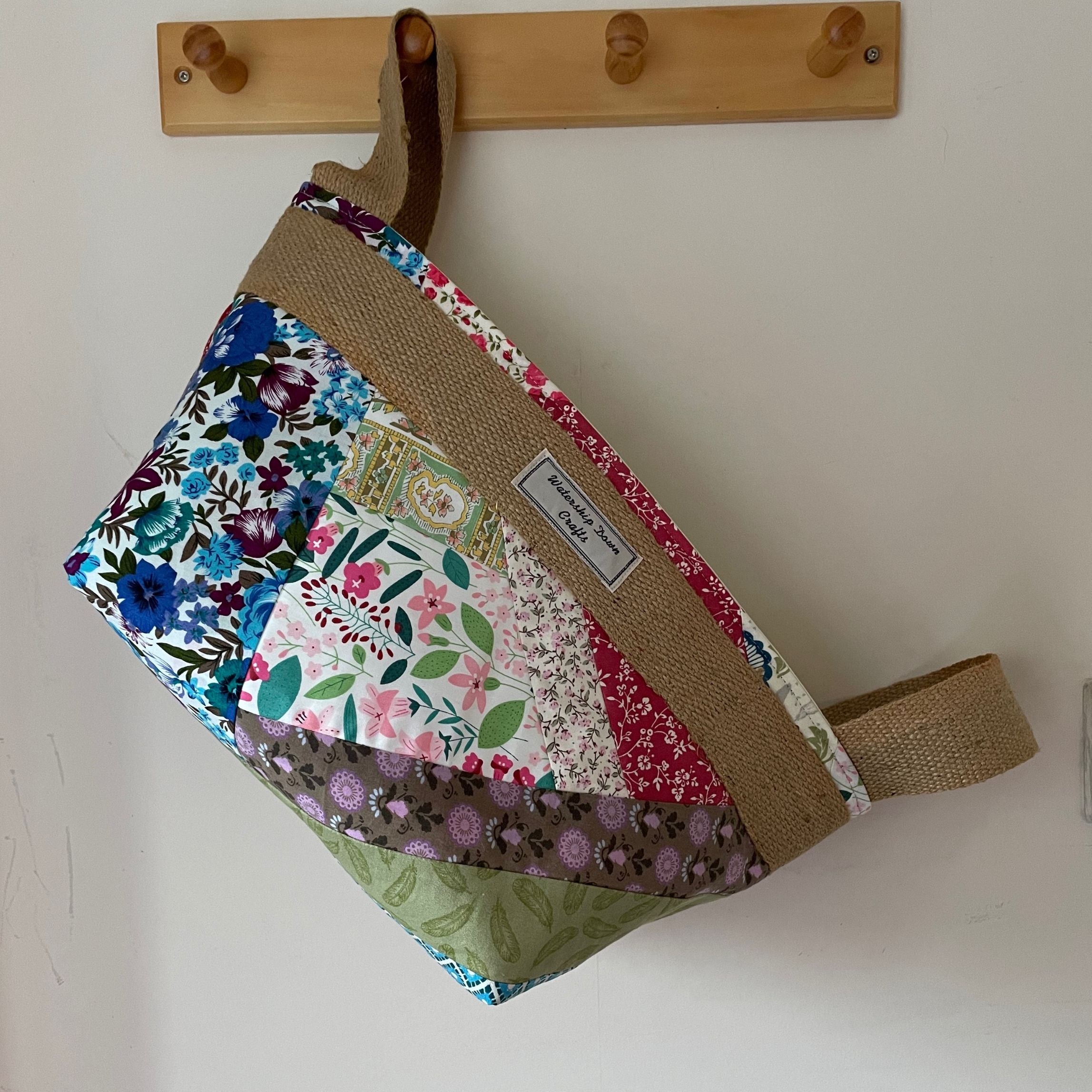 patchwork fabric basket on a peg